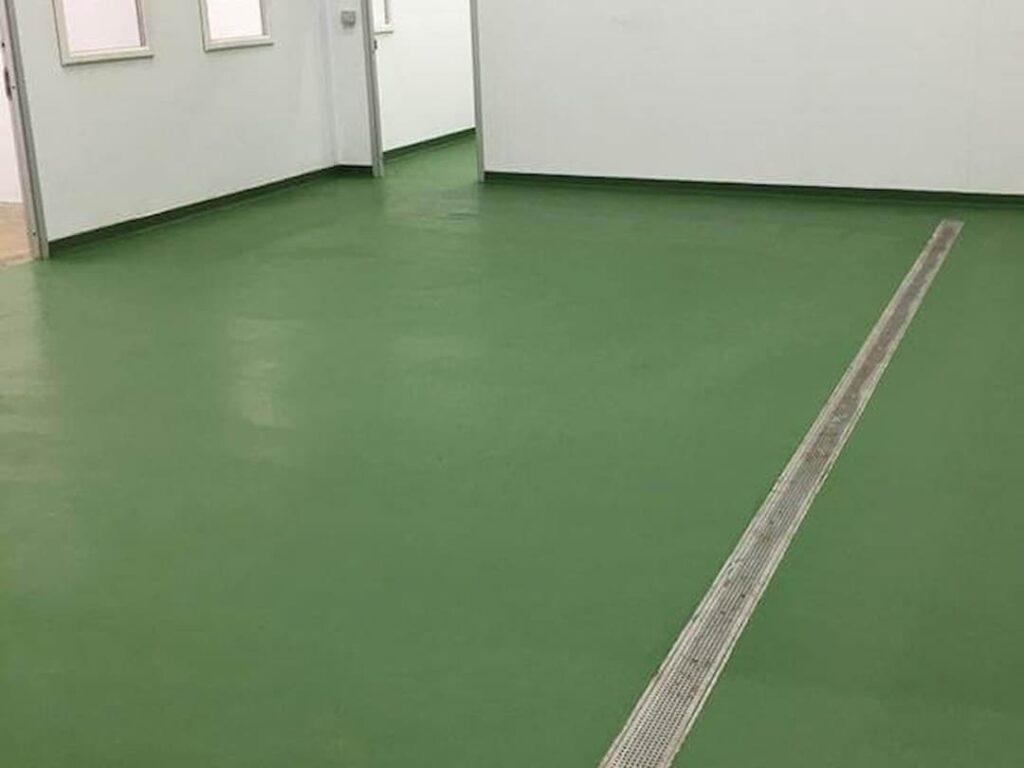 Empty room with green floor